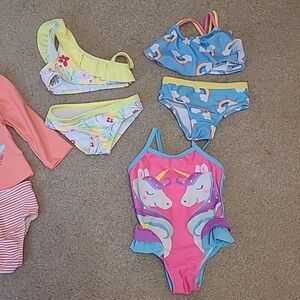 Size 12 months swimming suits lot